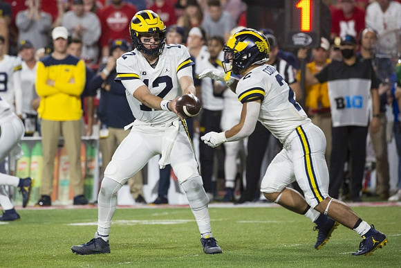 Cade McNamara (12) and Blake Corum (2)