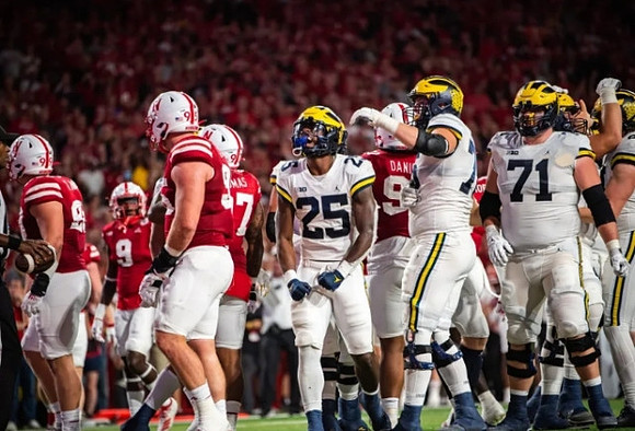 Hassan Haskins (25), Ryan Hayes (76), and Andrew Stueber (71)