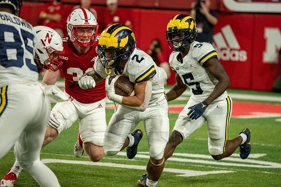 Daylen Baldwin (85), Blake Corum (2), and Mike Sainristil (5)