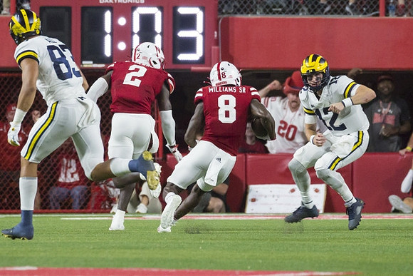 Erick All (83) and Cade McNamara (12)