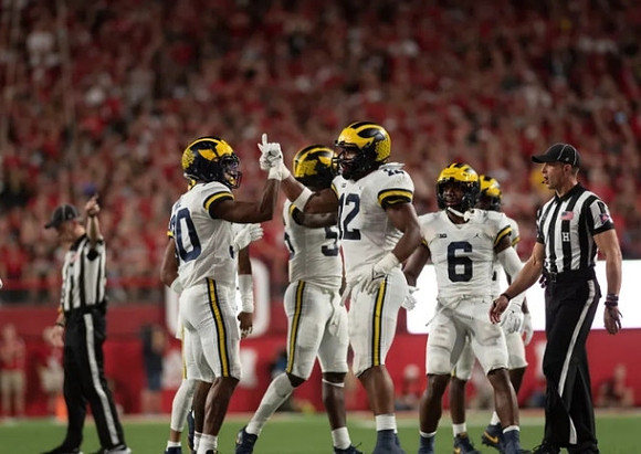 Daxton Hill (30), Josh Ross (12), and R.J. Moten (6)