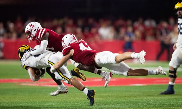 Blake Corum (2) and Andrew Vastardis (68)