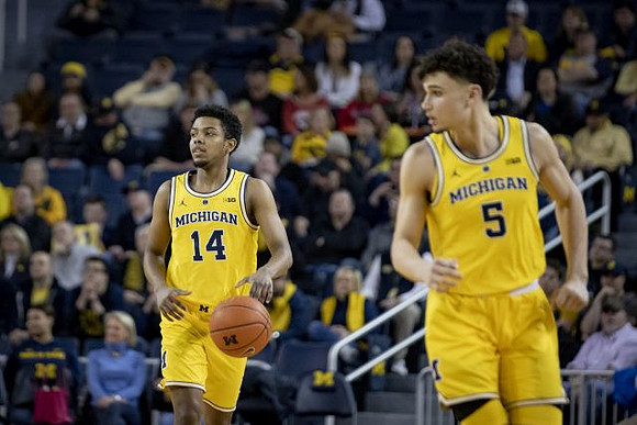 Rico Ozuna-Harrison (14) and Adrien Nunez (5)