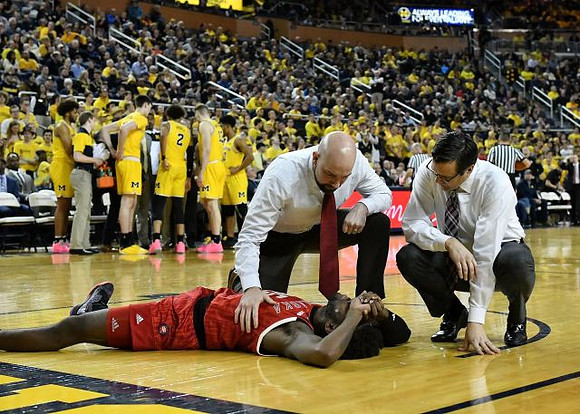 Nebraska Head Coach Tim Miles and Michigan Team