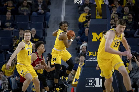 Ignas Brazdeikis (13), Zavier Simpson (3), and Jon Teske (15)