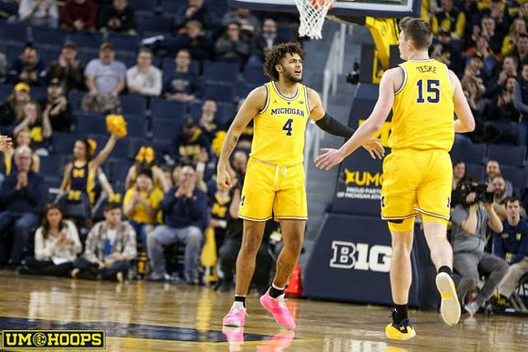 Isaiah Livers (4) and Jon Teske (15)