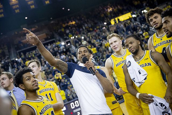 Charles Matthews (1) and Michigan Team