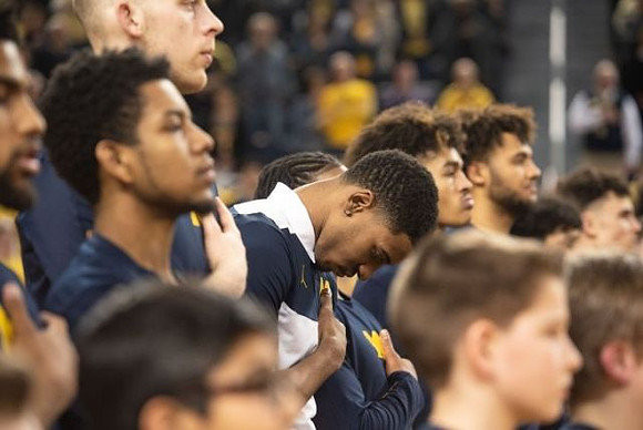 Charles Matthews (1) and Michigan Team