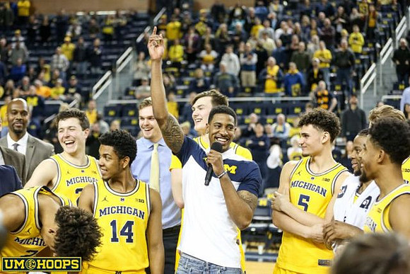 Charles Matthews (1) and Michigan Team