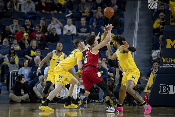 Zavier Simpson (3), Colin Castleton (11), and Isaiah Livers (4)