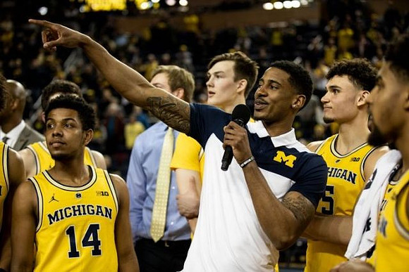 Charles Matthews (1) and Michigan Team