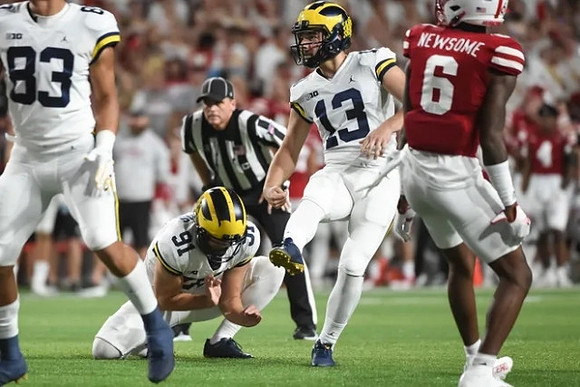 Erick All (83), Brad Robbins (91), and Jake Moody (13)
