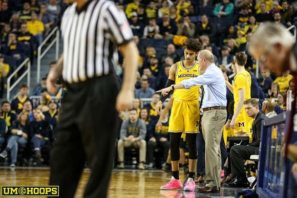 Jordan Poole (2), John Beilein, and Luke Yaklich