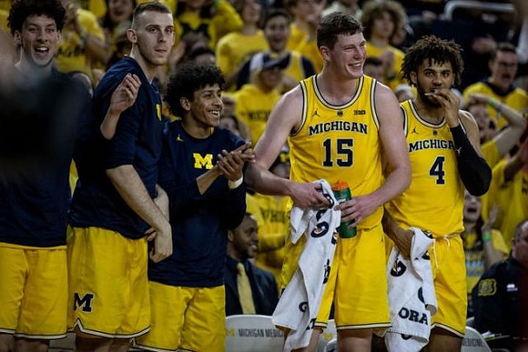 Brandon Johns Jr. (23), Austin Davis (51), Eli Brooks (55), Jon Teske (15), and Isaiah Livers (4)