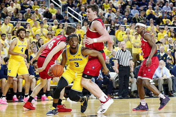 Isaiah Livers (4) and Zavier Simpson (3)