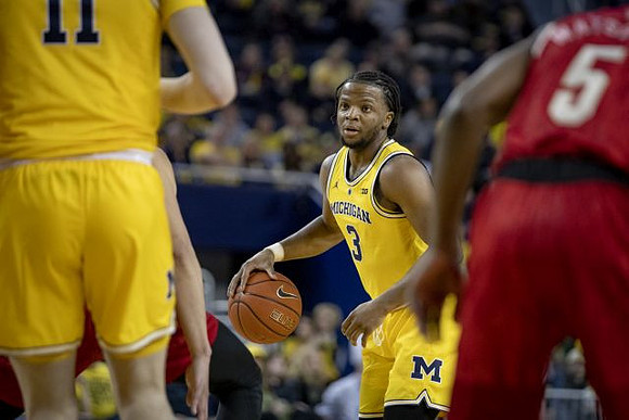 Colin Castleton (11) and Zavier Simpson (3)