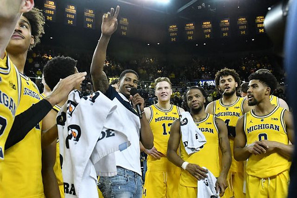 Charles Matthews (1) and Michigan Team