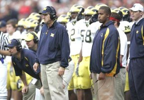 Jim Herrmann, Lloyd Carr, Shawn Crable (2), and Roy Manning (58)