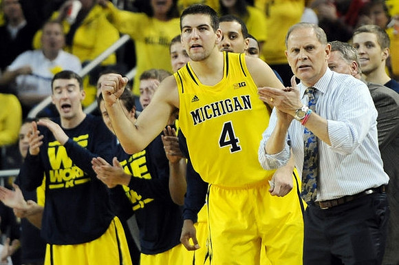 Mitch McGary (4) and John Beilein