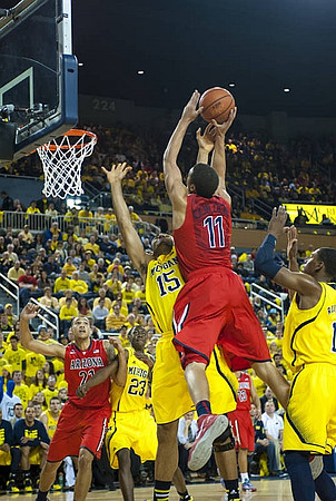 Jon Horford (15), Caris LeVert (23), and Glenn Robinson III (1)