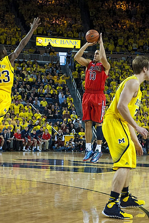 Caris LeVert (23) and Spike Albrecht (2)