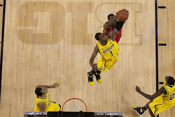 Jon Horford (15), Glenn Robinson III (1), and Caris LeVert (23)