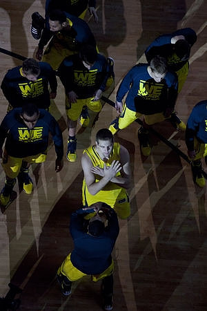 Mitch McGary (4) and Michigan Team