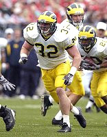 Michael Hart (20), Kevin Dudley (32), and Chad Henne (7)