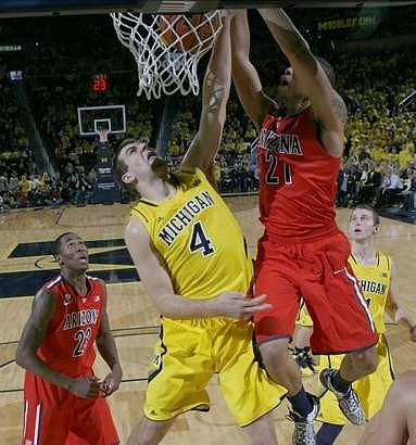 Mitch McGary (4) and Nik Stauskas (11)