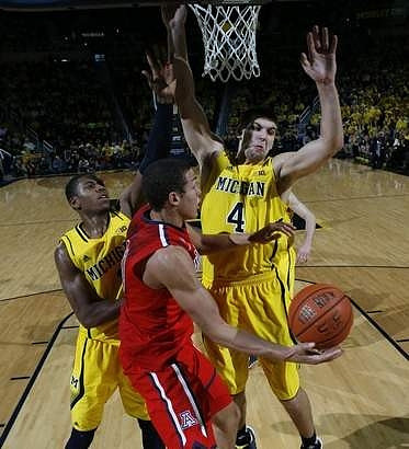 Glenn Robinson III (1) and Mitch McGary (4)