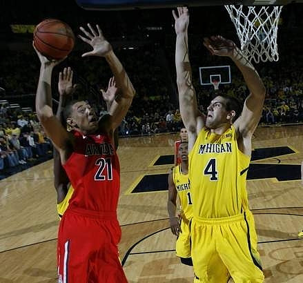 Mitch McGary (4) and Glenn Robinson III (1)