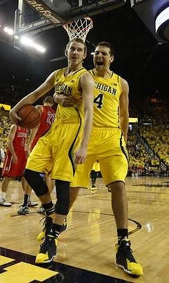 Nik Stauskas (11) and Mitch McGary (4)