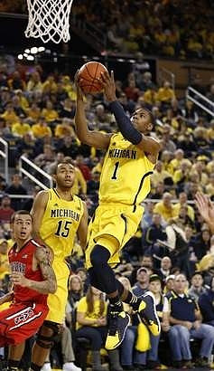 Jon Horford (15) and Glenn Robinson III (1)