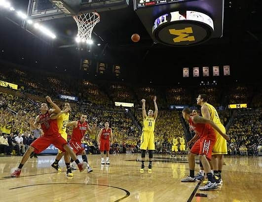 Jordan Morgan (52), Nik Stauskas (11), and Mitch McGary (4)
