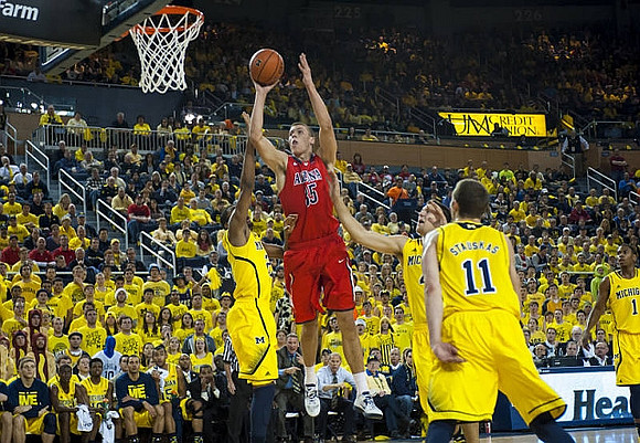 Caris LeVert (23), Mitch McGary (4), and Nik Stauskas (11)