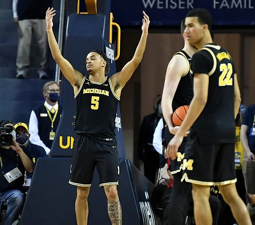 Terrance Williams II (5) and Caleb Houstan (22)