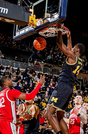 Moussa Diabate (14) and DeVante' Jones (12)