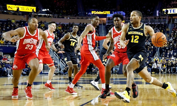 DeVante' Jones (12) and Moussa Diabate (14)