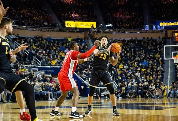Brandon Johns Jr. (23) and Hunter Dickinson (1)