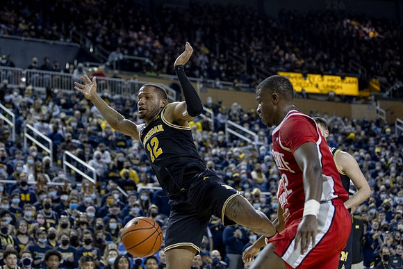 DeVante' Jones (12) and Hunter Dickinson (1)