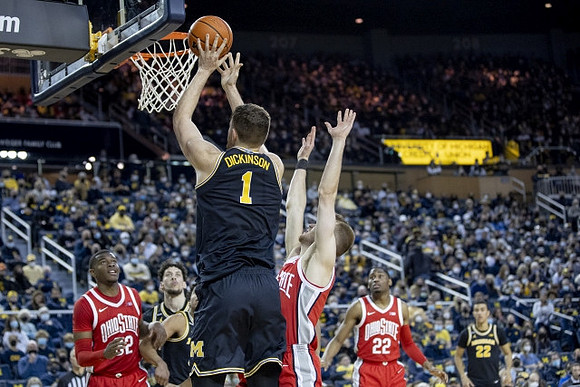 Hunter Dickinson (1), Brandon Johns Jr. (23), and Caleb Houstan (22)