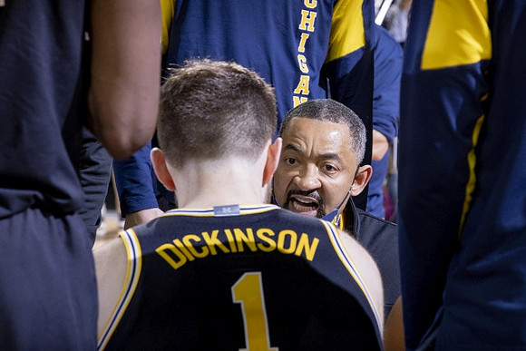 Hunter Dickinson (1) and Juwan Howard