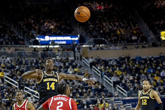 Moussa Diabate (14) and DeVante' Jones (12)