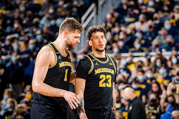 Hunter Dickinson (1) and Brandon Johns Jr. (23)