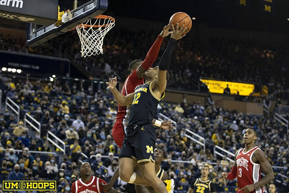 DeVante' Jones (12) and Caleb Houstan (22)