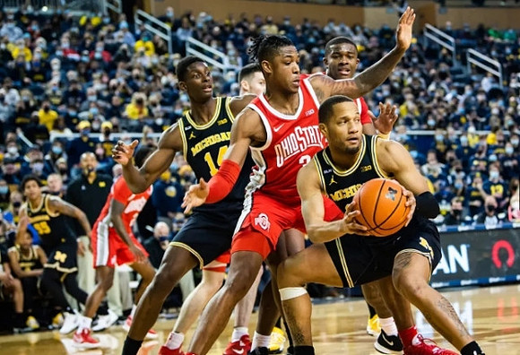 DeVante' Jones (12), Moussa Diabate (14), and Eli Brooks (55)