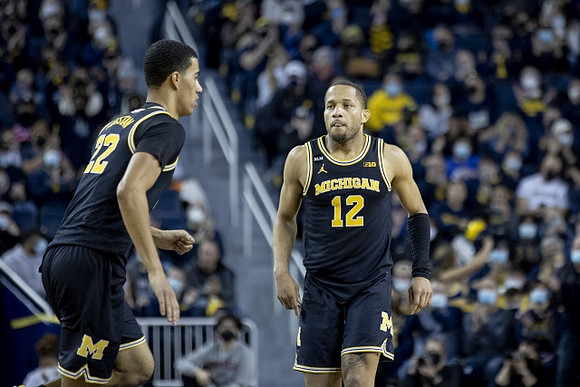 Caleb Houstan (22) and DeVante' Jones (12)