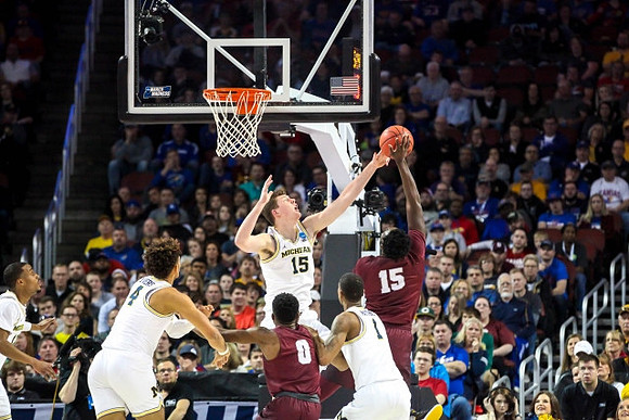 Muhammad-Ali Abdur-Rahkman (12), Isaiah Livers (4), Jon Teske (15), and Charles Matthews (1)