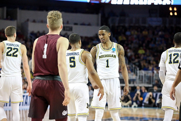Duncan Robinson (22), Jaaron Simmons (5), Charles Matthews (1), and Muhammad-Ali Abdur-Rahkman (12)