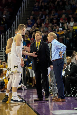 Moritz Wagner (13), Luke Yaklich, and John Beilein